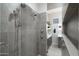 Tiled walk-in shower with dual shower heads, and sleek design for a luxurious bathing experience at 2656 E Oriole Dr, Gilbert, AZ 85297