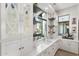 Well appointed wet bar featuring quartz countertops, wine racks, and view of the backyard at 2656 E Oriole Dr, Gilbert, AZ 85297