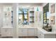 Wet bar with white cabinets, quartz countertops, beverage fridge, and outdoor view at 2656 E Oriole Dr, Gilbert, AZ 85297
