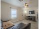 Bright living room featuring tile floors, neutral walls, and a ceiling fan at 2910 W Madison St, Phoenix, AZ 85009