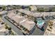 An aerial view of real estate showcasing community pool, patios, tile roofs and desert landscaping at 320 S 70Th St # 54, Mesa, AZ 85208