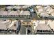 Birds-eye view of a residential area with houses featuring desert landscaping and red tiled roofs at 320 S 70Th St # 54, Mesa, AZ 85208