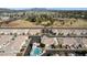 Wide aerial shot showing the layout of a neighborhood near recreation areas with desert landscaping and mountain views at 320 S 70Th St # 54, Mesa, AZ 85208