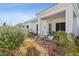 View of backyard showcasing the covered patio and desert plants at 320 S 70Th St # 54, Mesa, AZ 85208