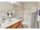 Bright bathroom with a shower and tub combination and seaside decor at 320 S 70Th St # 54, Mesa, AZ 85208