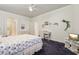 Bedroom features arched doorway, plush carpet, desk and dresser at 320 S 70Th St # 54, Mesa, AZ 85208