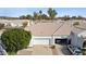 Aerial view of a well-maintained home with a driveway, two-car garage, and desert landscaping at 320 S 70Th St # 54, Mesa, AZ 85208