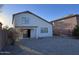 This backyard features desert landscaping and a covered patio at 3229 S 93Rd Ave, Tolleson, AZ 85353