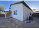 This backyard features desert landscaping and a covered patio at 3229 S 93Rd Ave, Tolleson, AZ 85353