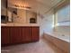 Bathroom featuring double sinks, and a separate tub at 3229 S 93Rd Ave, Tolleson, AZ 85353