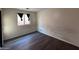 This bedroom features laminate floors and a window for natural light at 3229 S 93Rd Ave, Tolleson, AZ 85353