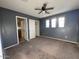 Bedroom with neutral carpet, closet space and ensuite bathroom at 3229 S 93Rd Ave, Tolleson, AZ 85353