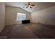 Bedroom featuring high ceilings, carpet, and a window at 3229 S 93Rd Ave, Tolleson, AZ 85353