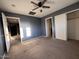 Bedroom with dark blue walls, carpet and closet space at 3229 S 93Rd Ave, Tolleson, AZ 85353