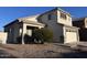 Two-story home with a two car garage, desert landscaping, and tile roof at 3229 S 93Rd Ave, Tolleson, AZ 85353