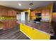 Open kitchen area with a central island and wrap-around countertops at 3229 S 93Rd Ave, Tolleson, AZ 85353