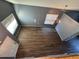 Lofted view of living room featuring hardwood floors and lots of light at 3229 S 93Rd Ave, Tolleson, AZ 85353