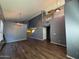 Living room featuring vaulted ceiling, hardwood floors, and staircase at 3229 S 93Rd Ave, Tolleson, AZ 85353