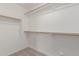 Walk-in closet with carpeted floor and wooden fixtures for customizable storage solutions at 35344 N Karan Swiss Cir, San Tan Valley, AZ 85143