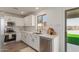 Modern kitchen featuring stainless steel appliances and white cabinetry at 35344 N Karan Swiss Cir, San Tan Valley, AZ 85143