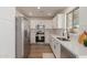 Modern kitchen featuring stainless steel appliances and white cabinetry at 35344 N Karan Swiss Cir, San Tan Valley, AZ 85143