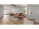 Open-concept living room featuring hardwood floors and ample natural light at 35344 N Karan Swiss Cir, San Tan Valley, AZ 85143