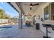 Covered patio area featuring a complete outdoor kitchen, views of the pool and a seating area at 3556 E Tiffany Way, Gilbert, AZ 85298