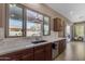 The kitchen sink faces a large window looking out onto the backyard patio at 3556 E Tiffany Way, Gilbert, AZ 85298