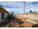 Wide backyard with tall block wall for privacy featuring desert landscaping and a utility pole at 3716 W Griswold Rd, Phoenix, AZ 85051