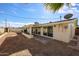 Back of home and backyard featuring desert landscaping and covered patio at 3716 W Griswold Rd, Phoenix, AZ 85051