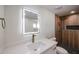 Modern bathroom with LED mirror, quartz countertop, and tiled shower with rainfall fixture at 3716 W Griswold Rd, Phoenix, AZ 85051