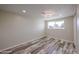 Bright bedroom showcasing wood-look floors and natural light from a window at 3716 W Griswold Rd, Phoenix, AZ 85051