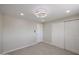 This bedroom features tile flooring, updated fan, and double closets in a neutral color palette at 3716 W Griswold Rd, Phoenix, AZ 85051