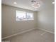 Bedroom with neutral walls, tile floors, and a window offering natural light at 3716 W Griswold Rd, Phoenix, AZ 85051