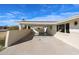 Spacious covered carport with brick accents and ample parking space, adjacent to the home at 3716 W Griswold Rd, Phoenix, AZ 85051