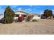 Single story home features manicured landscaping, with bright bushes and trees in the front yard at 3716 W Griswold Rd, Phoenix, AZ 85051