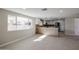 Well-lit open floor plan featuring a modern kitchen with stainless steel appliances at 3716 W Griswold Rd, Phoenix, AZ 85051