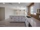 Large kitchen features white cabinets, stainless steel appliances, and granite countertops at 3716 W Griswold Rd, Phoenix, AZ 85051