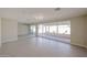 Spacious living room with large windows, tile floors, and recessed lighting at 3716 W Griswold Rd, Phoenix, AZ 85051