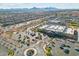 This aerial view showcases the community's ample parking, landscaping, and building design against a backdrop of distant mountains at 37292 N Yellowstone Dr, San Tan Valley, AZ 85140