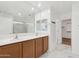 Bathroom features a double sink vanity, ample counter space, and a glass-enclosed shower at 37292 N Yellowstone Dr, San Tan Valley, AZ 85140