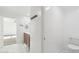 Bright white bathroom featuring a vanity, mirror, and a toilet with white tile flooring at 37292 N Yellowstone Dr, San Tan Valley, AZ 85140