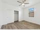 Bedroom featuring wood-look flooring, ceiling fan, and closet at 37292 N Yellowstone Dr, San Tan Valley, AZ 85140