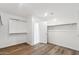 Spacious walk-in closet featuring wood-look floors, an open entrance, and ample shelving at 37292 N Yellowstone Dr, San Tan Valley, AZ 85140