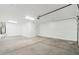 Spacious and clean garage with painted concrete floors at 37292 N Yellowstone Dr, San Tan Valley, AZ 85140