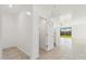 Hallway with tile flooring, leads to bright living space with sliding glass doors to the backyard at 37292 N Yellowstone Dr, San Tan Valley, AZ 85140