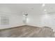 Open-concept living room with wood-look floors, recessed lighting, and natural light at 37292 N Yellowstone Dr, San Tan Valley, AZ 85140
