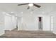 Bright living room featuring a ceiling fan, recessed lighting, and attractive wood-look flooring at 37292 N Yellowstone Dr, San Tan Valley, AZ 85140