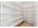 Walk-in pantry with white shelving and tile flooring at 37292 N Yellowstone Dr, San Tan Valley, AZ 85140
