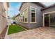Charming backyard with pavers and turf between homes at 3868 E Robert St, Gilbert, AZ 85295